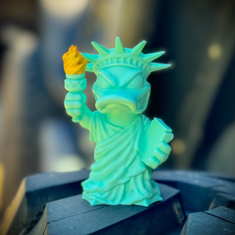 Colorful Statue of Liberty figurine with a blurred background