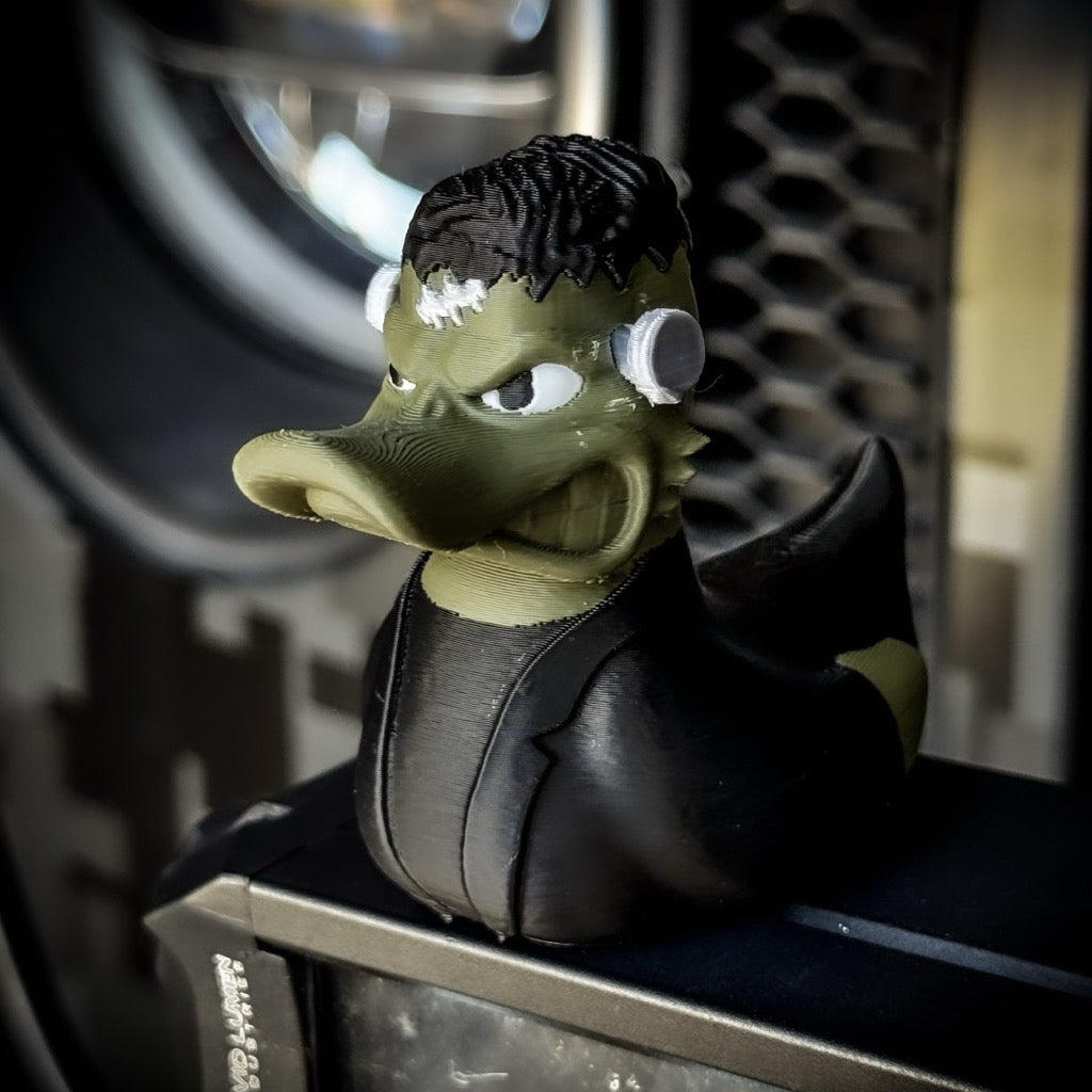 Toy figure of a creature with green skin and black hair on a blurred background