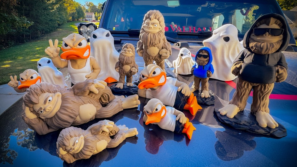 Bigfoot and duck figures big and small 