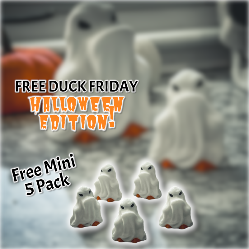 Blurry photo of five small FirstWarrior FDF - Mini 5 Pack PLA duck toys dressed as ghosts, with “Free Duck Friday Halloween Edition” and “Free Mini 5 Pack” text. Large ghost duck decorations in background. Great for any duck keychain collection!.